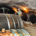 Tony inspects the barrels of wine at Dr. Pauly Bergweiler